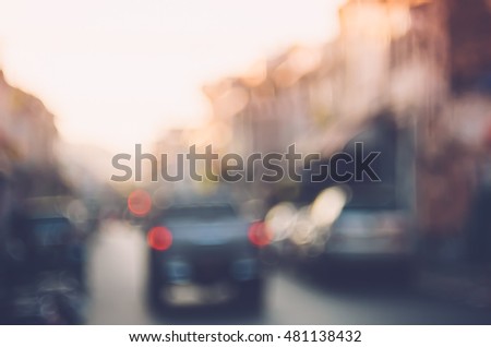Blur traffic road with colorful bokeh light abstract background. Copy space of transportation and travel concept. Retro tone filter color style.
