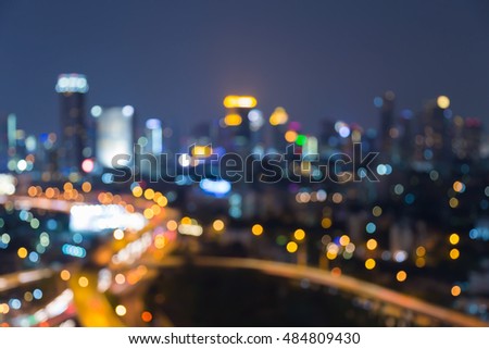 Night blurred lights, city downtown and highway, abstract background 