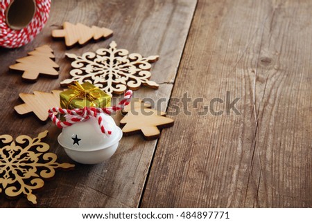 Christmas tree decoration next wooden snowflakes. Selective focus