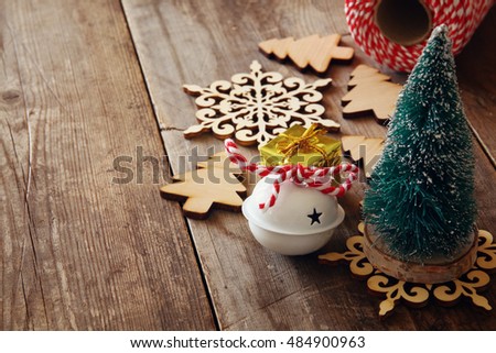 Christmas concept. Decorative tree next to decorations and craft supply. Selective focus