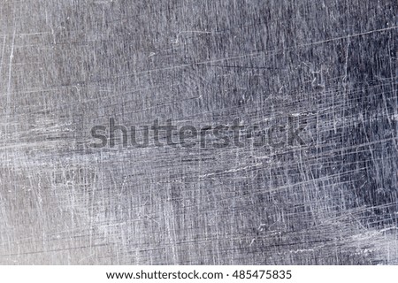 Scratches on the metal background.