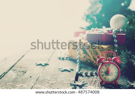 Composition with vintage alarm clock showing five to midnight . Happy New Year 2017 