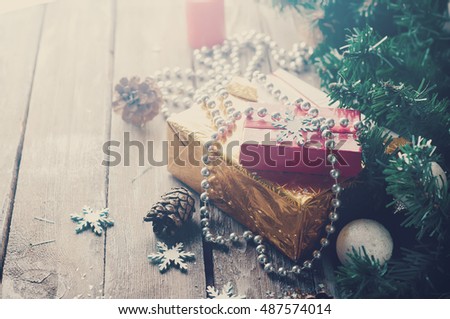 Gift boxes handmade, decorated in a rustic style. Christmas decoration in a wooden background