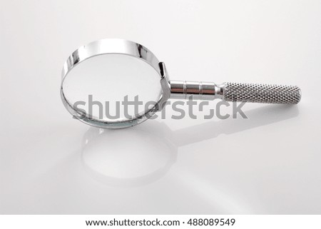 small magnifier glass on the white background
