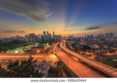 Kuala Lumpur city skyline on sunset ray of light sky