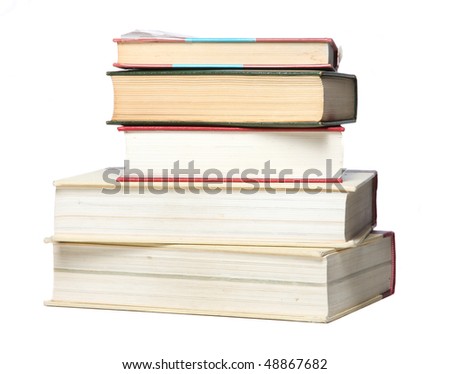 Different size books stacked on isolated white background
