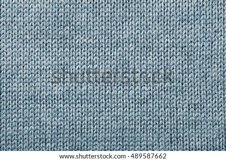 Closeup knitting blue texture for you winter background 