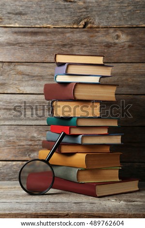 Old antique books on grey wooden table