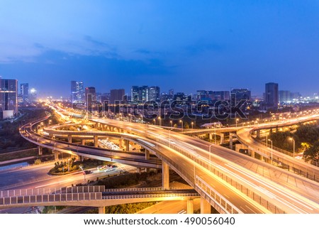 traffic on city road and cityscape  at night
