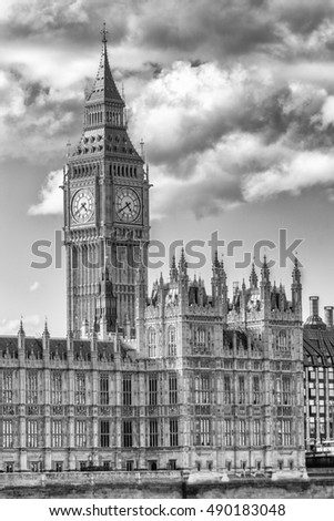 The Big Ben and Houses of Parliament against blue sky - London, UK.