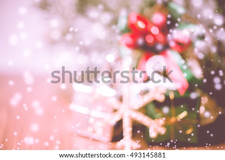 Blurry bokeh light of chrismas for background,x'mas,Merry Christmas,snow fill,snowing,vintage,warm tone