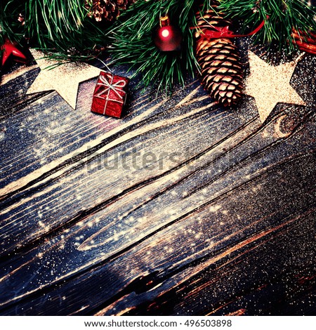 Christmas decorations on a rustic wood background, vintage retro style. Winter Xmas card
