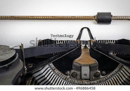 Vintage typewriter with ' Technology ' typed onto white paper with copy space.