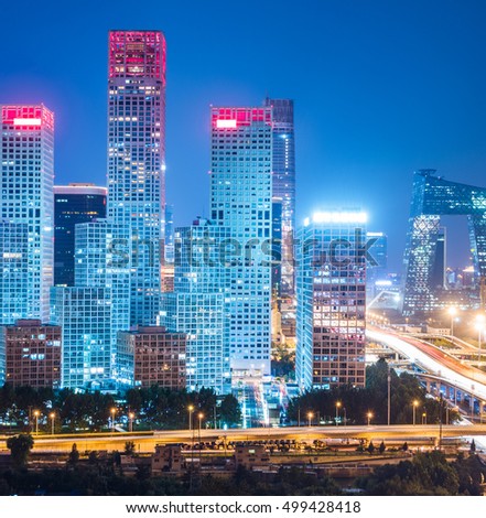 illuminated modern buildings at night in China.