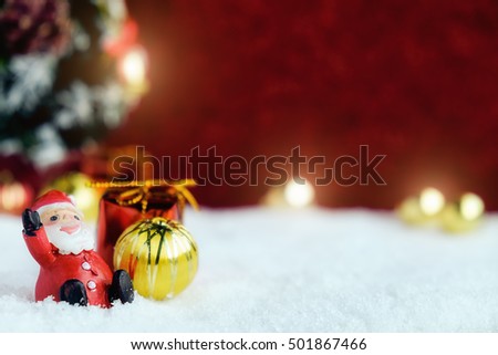 Christmas decorations with snow and red background.close up and selective focus.