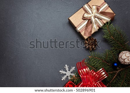 Christmas decorations and present on a dark  background