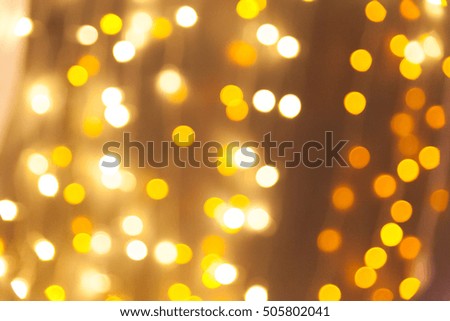 Christmas background with golden bokeh lights