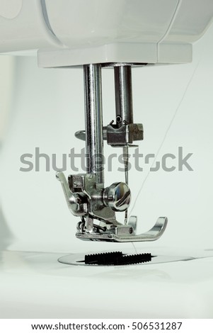 Sewing electricity Used to repair the damaged fabric on a white background.
