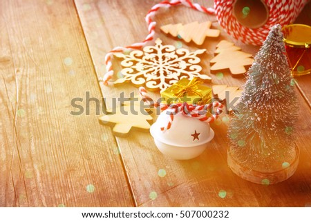 Christmas concept. Decorative tree next to decorations and craft supply. Selective focus