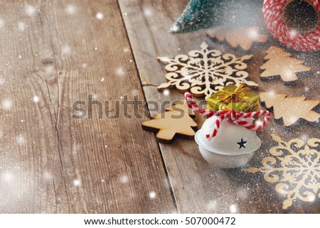 Christmas tree decoration next wooden snowflakes. Selective focus