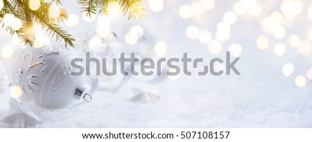 Bright Christmas; Holidays background with Xmas decoration  on snow
