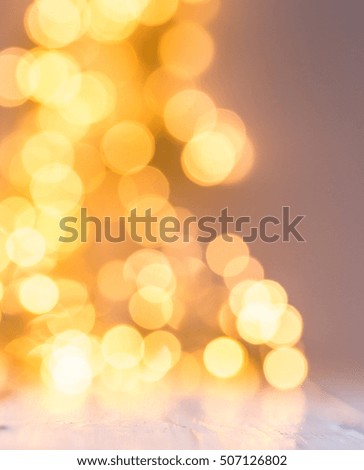 yellow sparkling unfocused lights abstract background