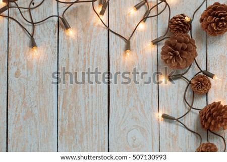 christmas lights on blue wooden background