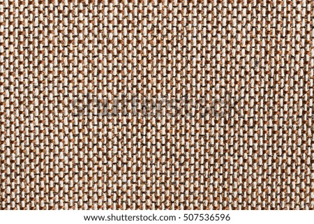 Blurred handmade weaving cloth,fabric,bamboo,wooden material pattern,textured for background in light brown toned color and blurred focus