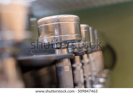 Closeup of many silver barbells