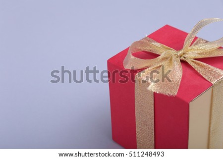 Gift boxes with bow on gray background.