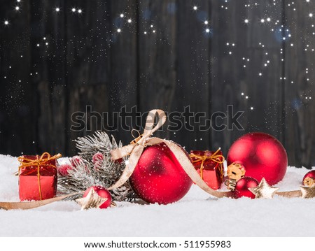 Christmas background with decorations, red celebration balls on wooden board