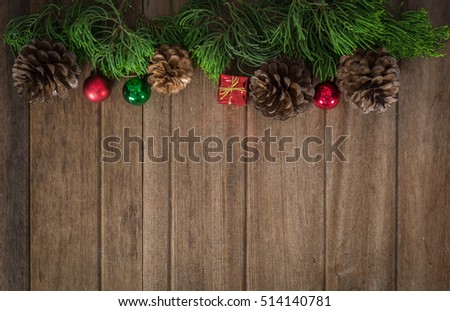 Christmas border design on the wooden background