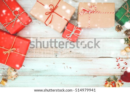 Christmas background - Christmas present gifts box and snow on wooden background. vintage color tone 