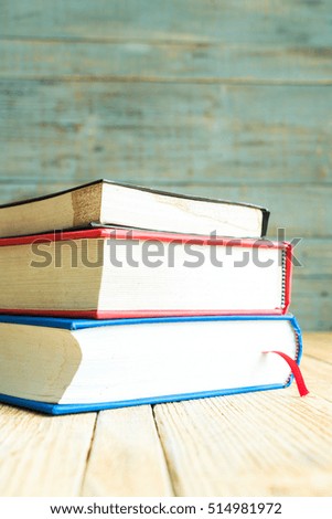 Books on the wooden old background
