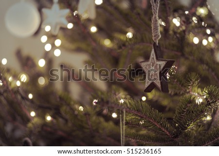 Rustic modern christmas decoration star hanging on a natural pine