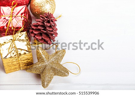 Christmas set, Christmas toys space for text on the greeting card. gold and red toy.