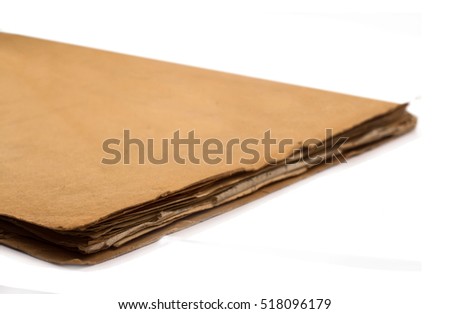 close up of closed brown and worn old paper document holder isolated on white