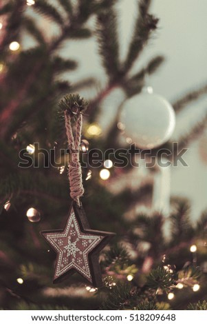 Rustic modern christmas decoration star hanging on a natural pine