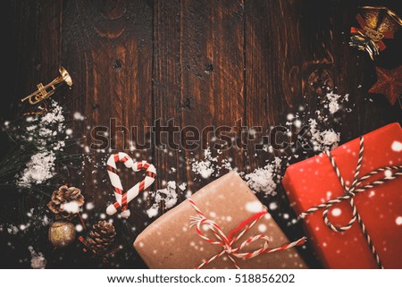 Christmas background with decorations and gift boxes on wooden board. vintage styles.