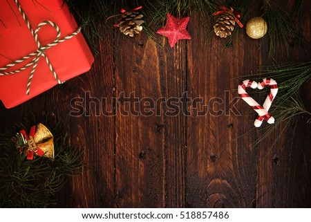 Christmas presents (Hand crafted Christmas gift box) with decorations on dark wooden background in vintage style
