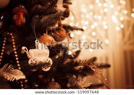 Beautiful decorated Christmas and New Year tree in evening time. Blank space right. Close-up