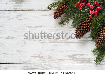 Christmas fir tree branch cone and decorations at white wooden table. Flat lay with copy space.