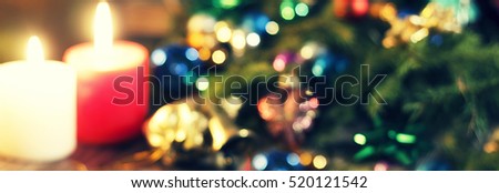 Christmas bokeh. New Year Christmas. Decorated Christmas tree, presents, candles, gifts. Shallow depth of field. Festive bokeh.