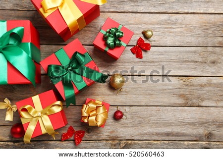 Gift boxes with ribbon on grey wooden table