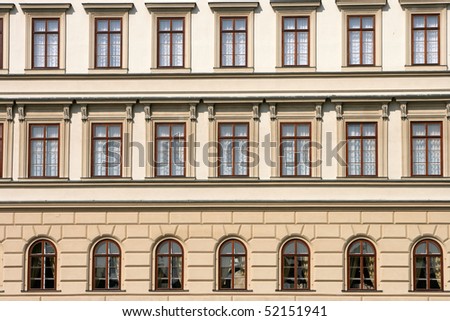 A building with several beautiful window panes in Prague, Czech Republic