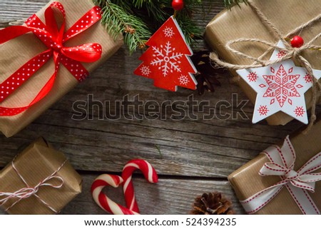 christmas presents in decorative boxes, white wood background
