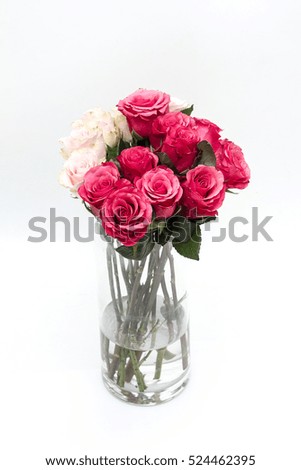 Roses in a jar over the white isolated background