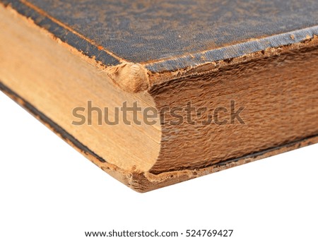 Ancient book close-up, isolated on white background. Selective focus