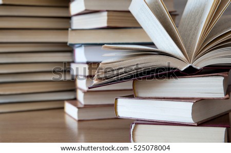 books on wooden deck tabletop