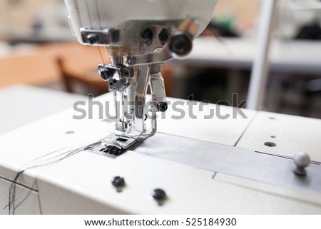 Sewing machine head close-up free space. Important part of garment equipment. Shuttle a needle detail photo. Seamstress tool, clothes making, tailor workshop concept